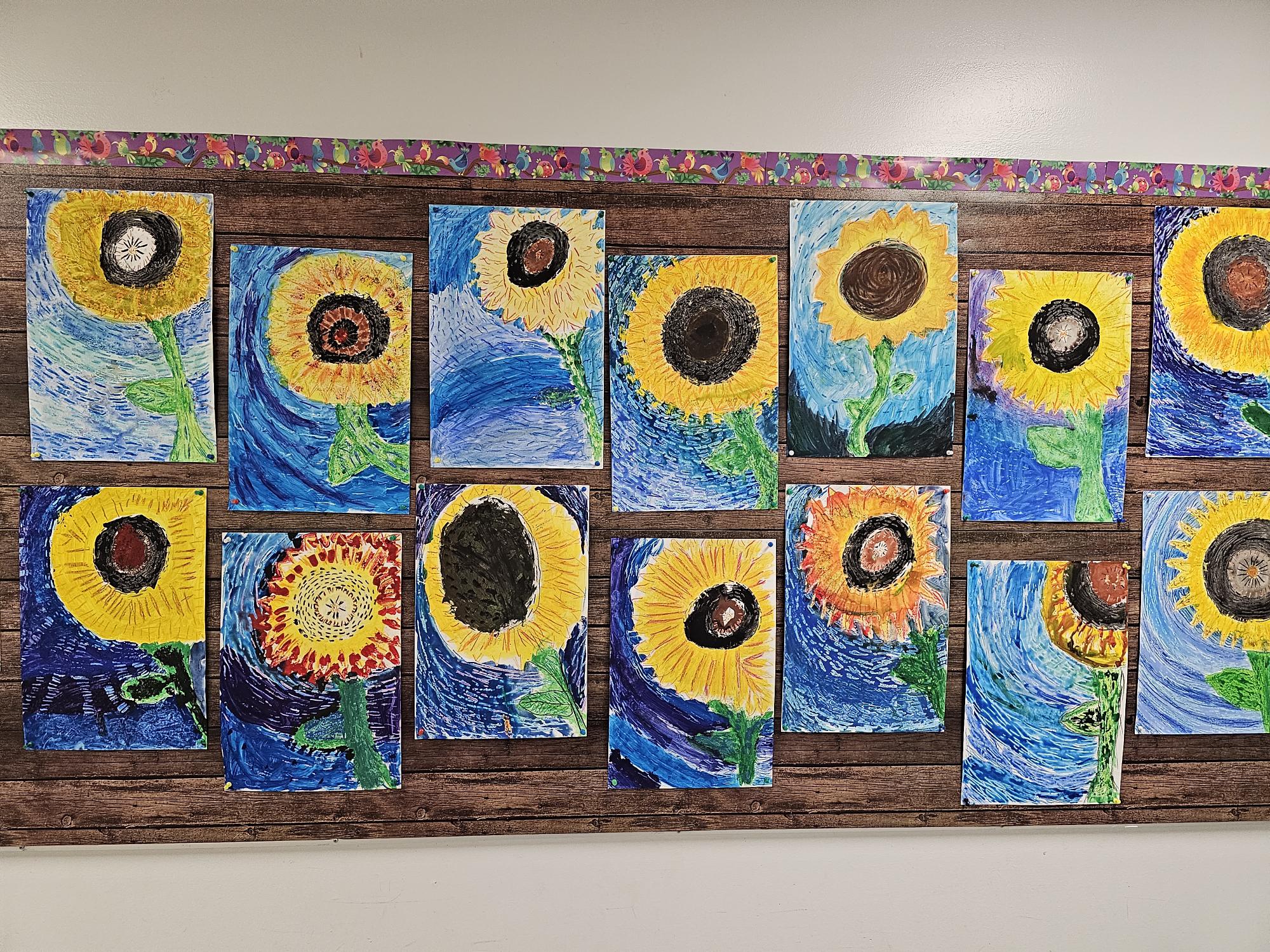 A group of sunflowers on a wall</p>
<p>Description automatically generated