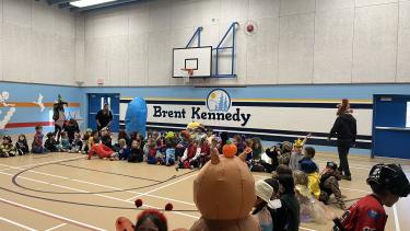 students in circle for Halloween Costume Parade